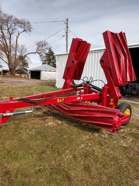 Twenty foot I & J crimper crop roller in a field